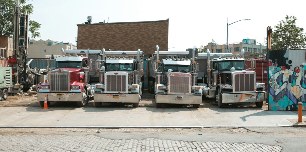 a group of trucks parked on the side of a road